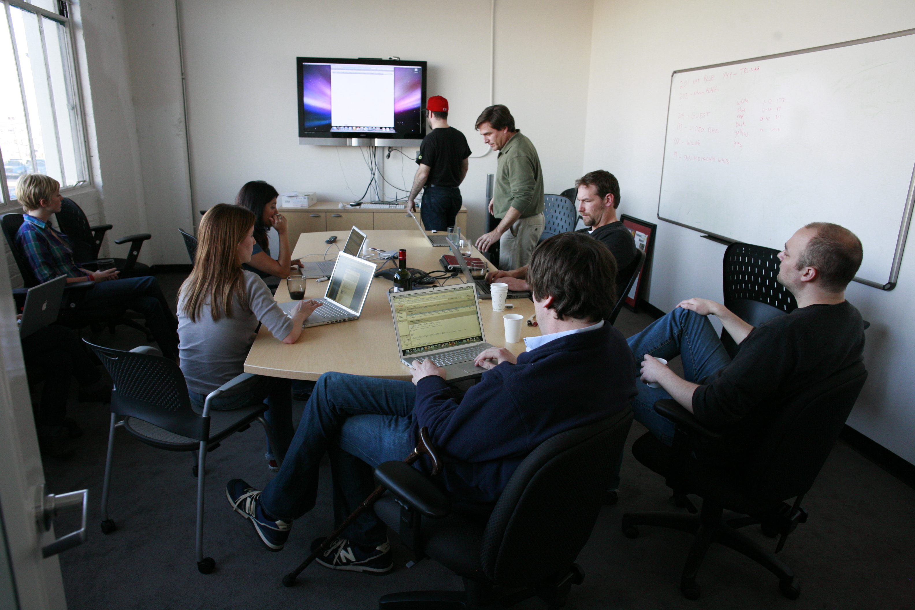 Consulting team working together at an office table